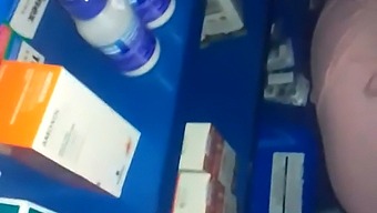 Intimate Encounter In A Pharmacy Amidst Various Medicines